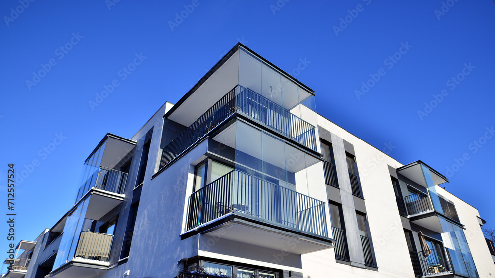 Modern apartment building in sunny day. Exterior, residential house facade. Residential area with modern, new and stylish living block of flats. Modern apartment building in sunny day. Exterior, residential house facade. Residential area with modern, new and stylish living block of flats.