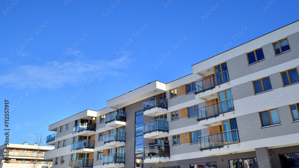 Modern apartment building in sunny day. Exterior, residential house facade. Residential area with modern, new and stylish living block of flats. Modern apartment building in sunny day. Exterior, residential house facade. Residential area with modern, new and stylish living block of flats.