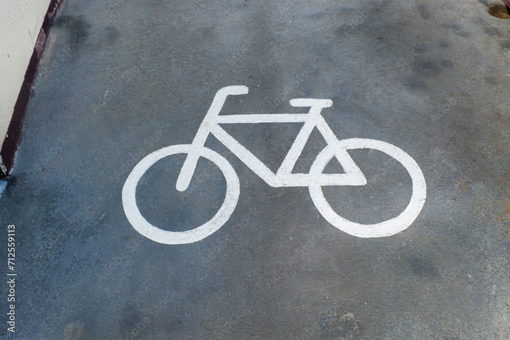 Road sign bicycle path on the road,Traffic sign for exclusive lane for bicycles in the city,bicycle sign on asphalt,Bicycle path, road marking element with graphic bicycle sign,Space for text. Road sign bicycle path on the road,Traffic sign for exclusive lane for bicycles in the city,bicycle sign on asphalt,Bicycle path, road marking element with graphic bicycle sign,Space for text.