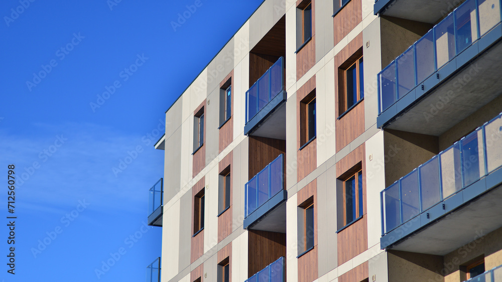 Modern apartment building in sunny day. Exterior, residential house facade. Residential area with modern, new and stylish living block of flats. Modern apartment building in sunny day. Exterior, residential house facade. Residential area with modern, new and stylish living block of flats.