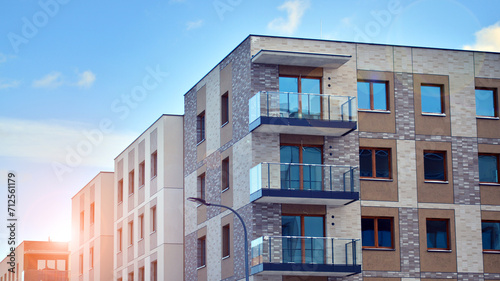Modern apartment building in sunny day. Exterior, residential house facade. Residential area with modern, new and stylish living block of flats.  © Grand Warszawski