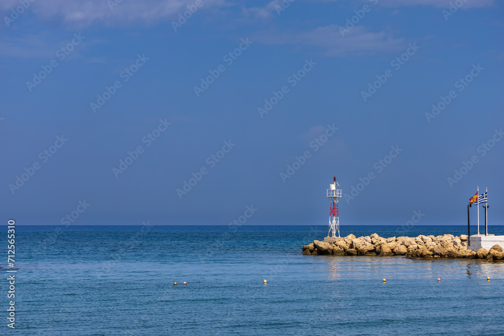 Seascape. The lighthouse at the church in the town of Faliraki in Greece on the island of Rhodes.
