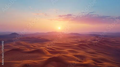 Soft hues of sunset over the tranquil and undulating dunes of a peaceful desert.