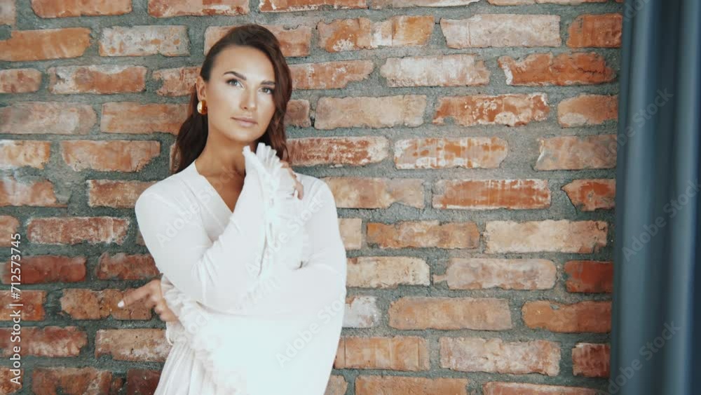 Elegant bride in the morning in a dressing gown. young attractive woman in white lingerie Elegant bride in the morning in a dressing gown. young attractive woman in white lingerie