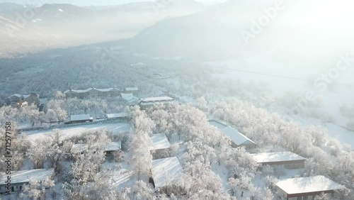 Winter mountain snow field, car drive on snow country road