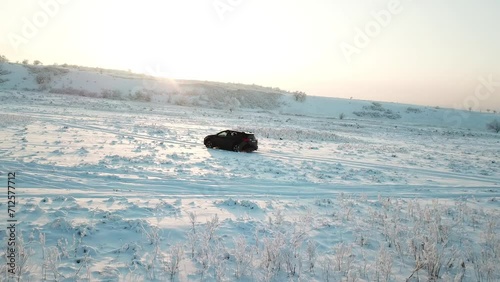 Winter mountain snow field, car drive on snow country road