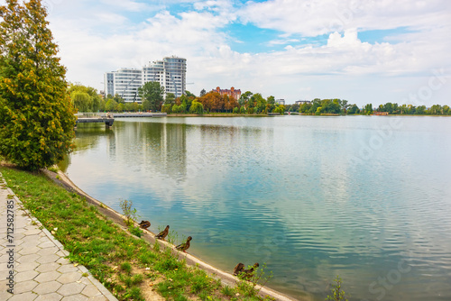Lake in Ivano-Frankivsk city (Ukraine) on a summer day, a famous vacation spot on the shore and on the water
