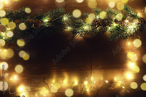 Christmas and New Year wooden background with light. Border art design with Christmas tree