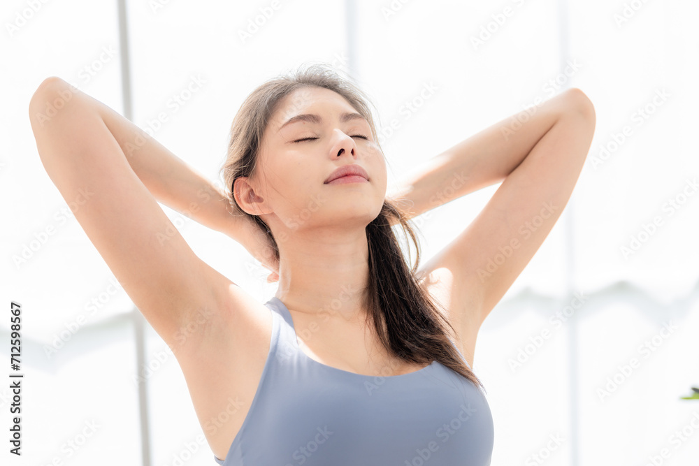 woman confident training yoga. Athletic women in sportswear doing fitness stretching exercises at home in the living room. Sport and recreation concept. woman confident training yoga. Athletic women in sportswear doing fitness stretching exercises at home in the living room. Sport and recreation concept.