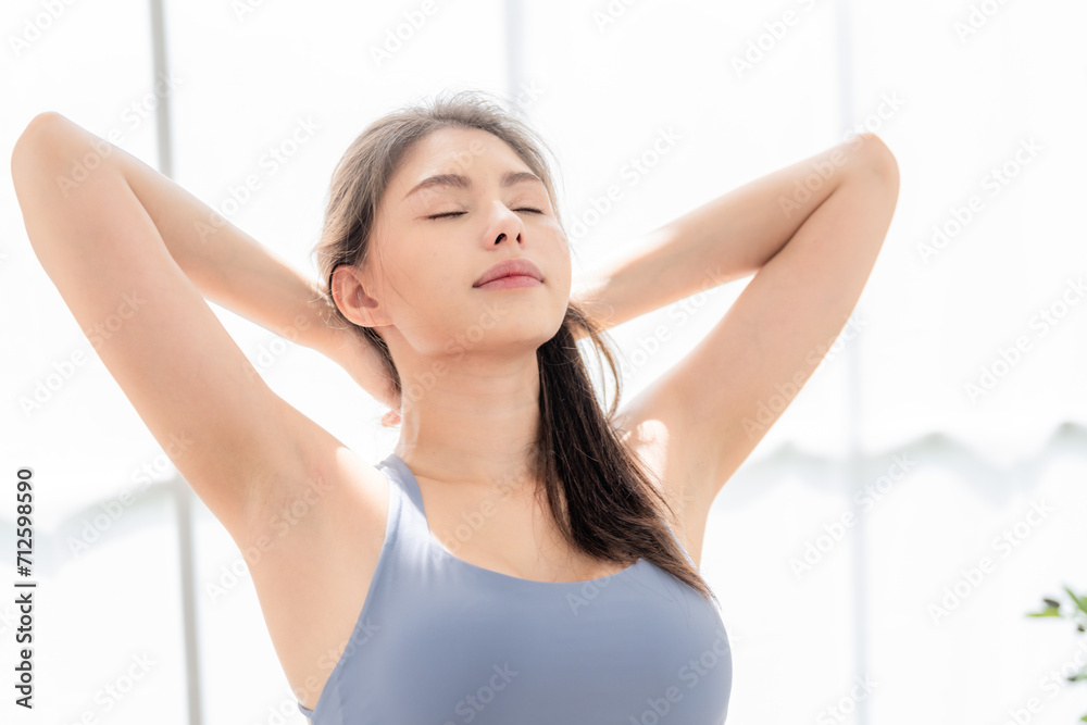 woman confident training yoga. Athletic women in sportswear doing fitness stretching exercises at home in the living room. Sport and recreation concept. woman confident training yoga. Athletic women in sportswear doing fitness stretching exercises at home in the living room. Sport and recreation concept.
