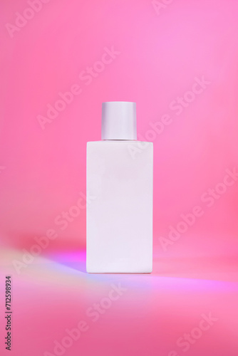 Perfume bottle photographed with minimal and creative background.