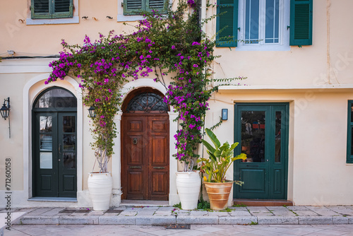 Vintage Mediterranean old town street with traditional old houses  beautiful doors and windows  with bougainvillea.