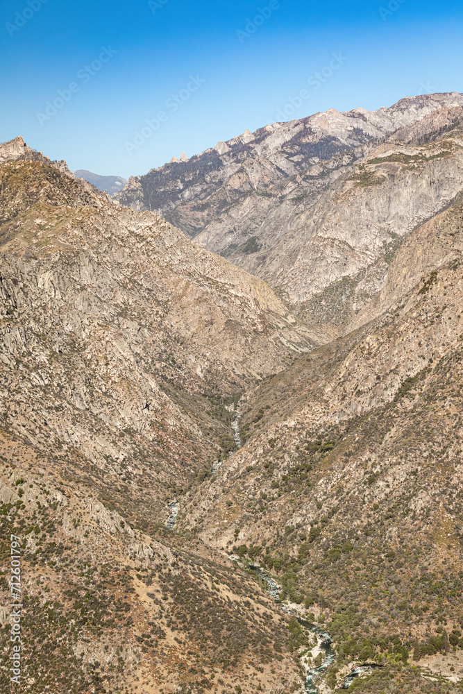 Fototapeta premium Steep canyon walls leading to the South Fork Kings River below in Kings Canyon National Park California during summer. 