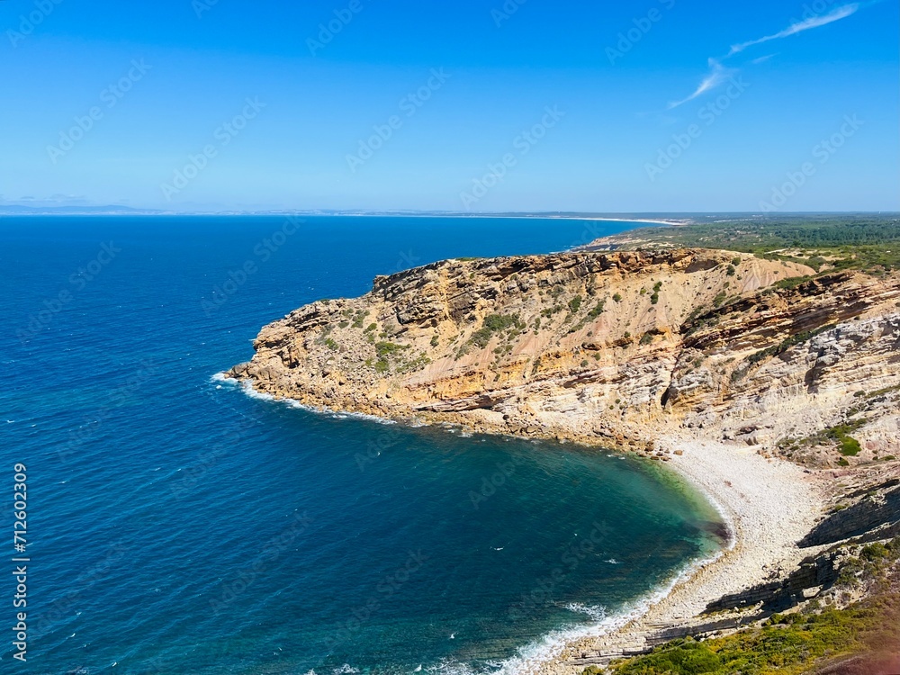 Ocean coast, rocky coastline of the ocean bay, clear blue sky Ocean coast, rocky coastline of the ocean bay, clear blue sky
