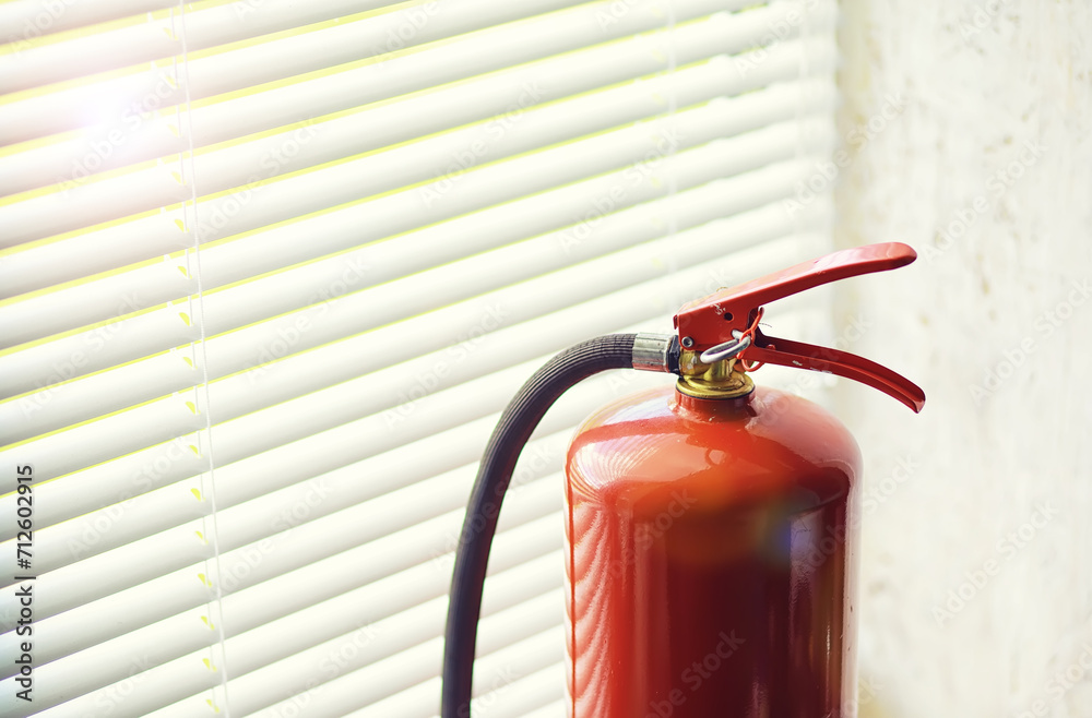 Fototapeta premium Fire extinguisher has hand engineer inspection checking pressure gauges to prepare fire equipment for protection and prevent emergency and safety rescue and alarm system training concept.