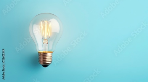 Light bulb on blue background. Concept of idea, innovation and creativity.