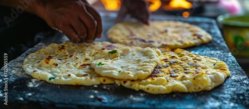 Indian street food called Parrota or flat bread in the making. photo