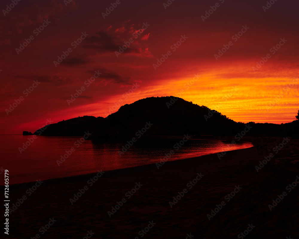 Fototapeta premium Fire sunset in Cilento, Foce del Mingardo