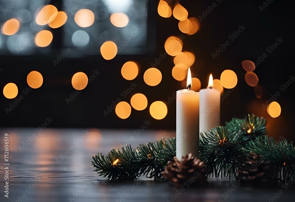 candles sit on a table with a christmas decoration behind it
