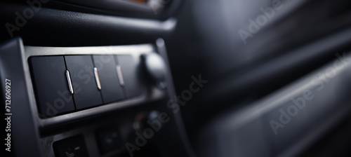 The process of choosing climate control in the car. Various controls in auto switches. Modern car interior photo