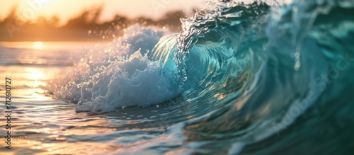 Close-up shot of a wave breaking at the beach. © AkuAku