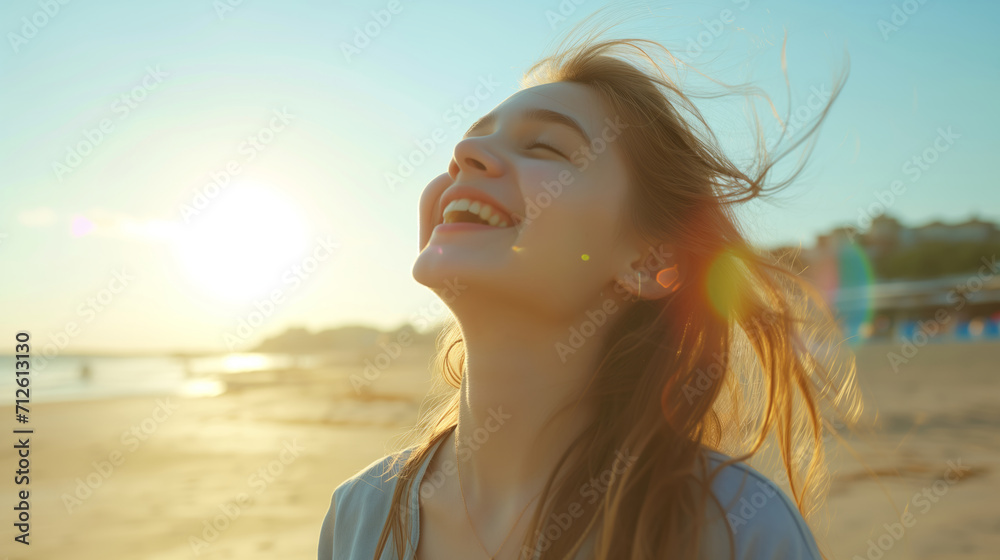 A teenage girl happily enjoying herself on a sunny beach during a warm day. girl on the beach in the summer. travelling alone concept, happy moment. 