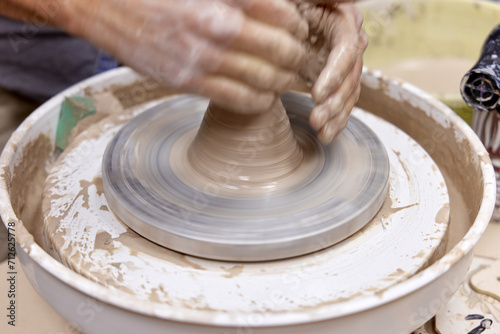 male hands making ceramic cup on pottery wheel, Close-up