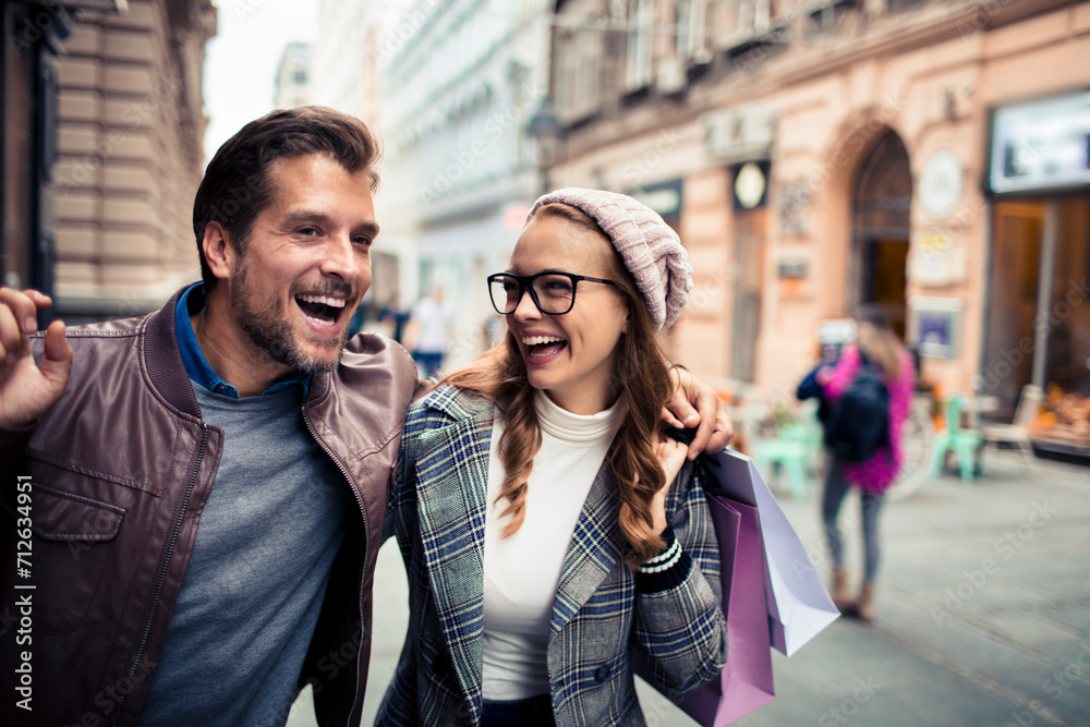Happy Couple Shopping and Walking in the City Happy Couple Shopping and Walking in the City
