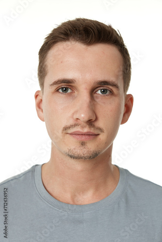 handsome young calm man on white background