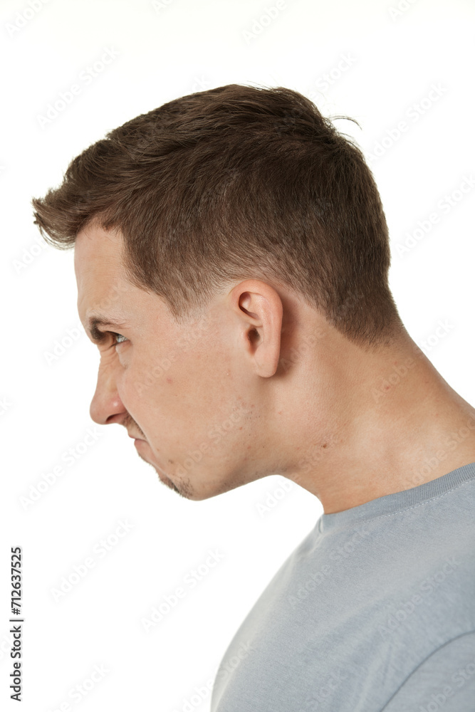 offended frustrated young man on white background. sadness offended frustrated young man on white background. sadness