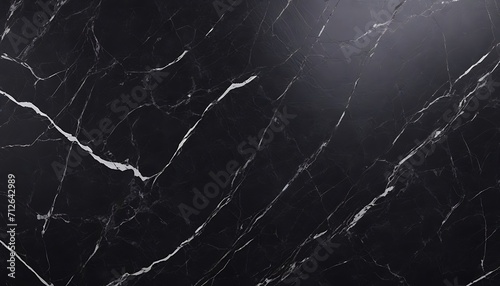 Black and grey marble block texture background, single studio light on upper right corner  photo
