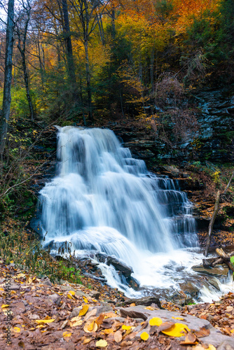 Fototapeta Naklejka Na Ścianę i Meble -  Cascade of waterfalls in a mountain gorge, fast flowing water, long exposure