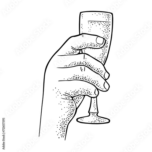 Male hand holding and clinking glass champagne. Vintage engraving