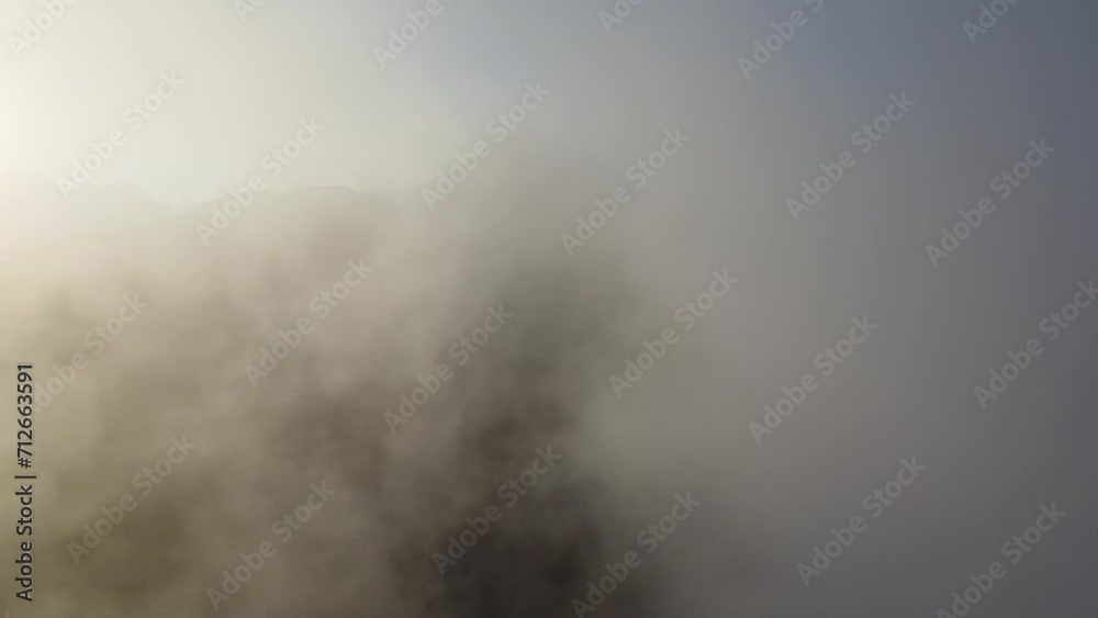 Volcano Etna through the clouds - Aerial shot 