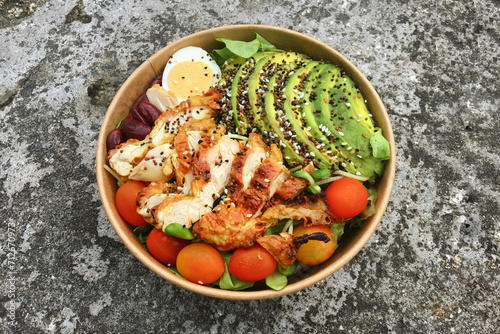 Grilled chicken salad serve as a healthy lunch box for delivery service and takeway.