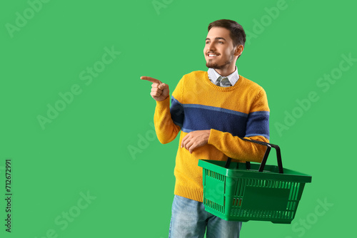 Young man with shopping bas...