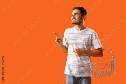 Young man with shopping bas...