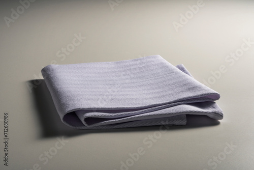 Perspective view of folded light blue napkin
