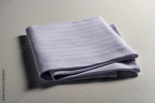 Perspective view of folded light blue napkin