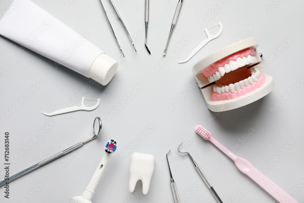 Frame made from dental tools, oral hygiene supplies and plastic models on white background. World Dentist Day Frame made from dental tools, oral hygiene supplies and plastic models on white background. World Dentist Day