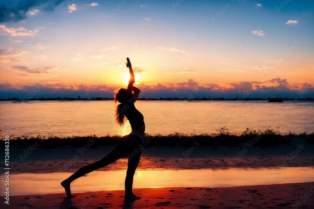 Young woman practicing yoga on the beach at sunrise. Yoga concept.