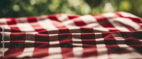 Red and white checkered tablecloth on wood table