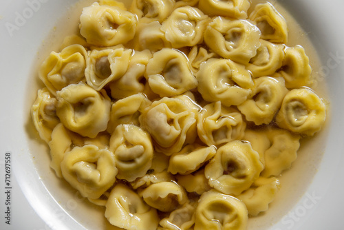 Top view of Soup bowl with tortellini in broth