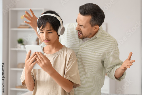 Teenage boy in headphones w...