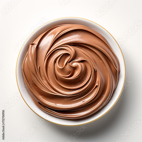 Bowl of chocolate cream isolated on white background with clipping path, swirl of hazelnut paste