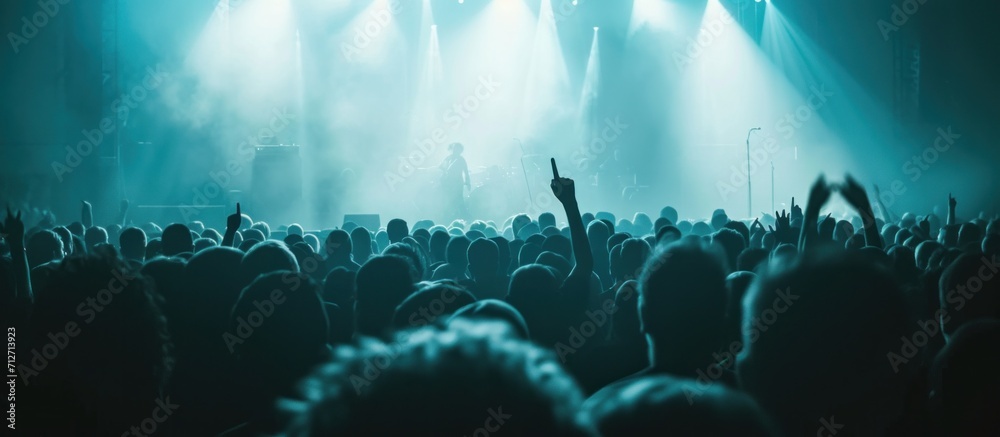 an image of an audience in a concert - obrazy, fototapety, plakaty 