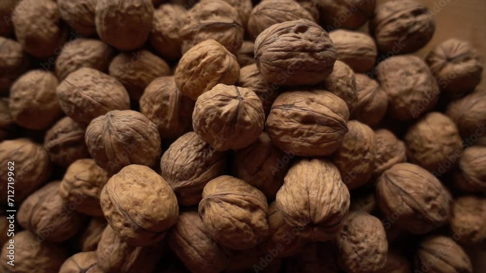 Walnuts. Camera slowly moves up to show close-up of beautiful walnuts Walnuts. Camera slowly moves up to show close-up of beautiful walnuts