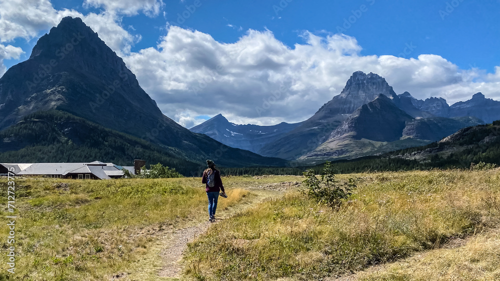 Woman Hiking around Swiftcurrent Lake in Many Glacier Region of Glacier National Park