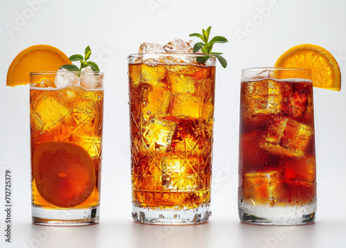 Glasses of cocktails over white background. A colorful image featuring three glasses filled with various kinds of beverages.