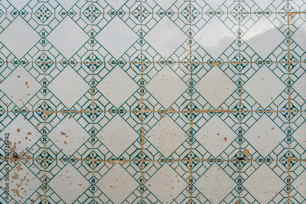 Ceramic square  tiles with small ornamental mosaic pieces. Old tiles abstract pattern